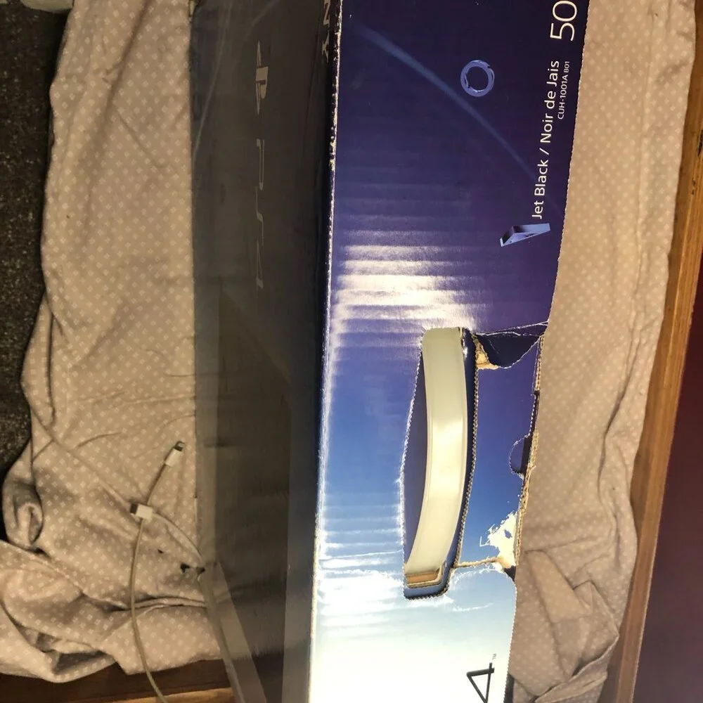 Sony PlayStation 4 with cords no controller.
